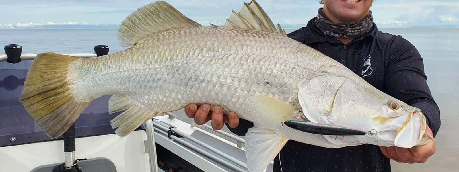 Strada Pro Lures person holding a barramundi